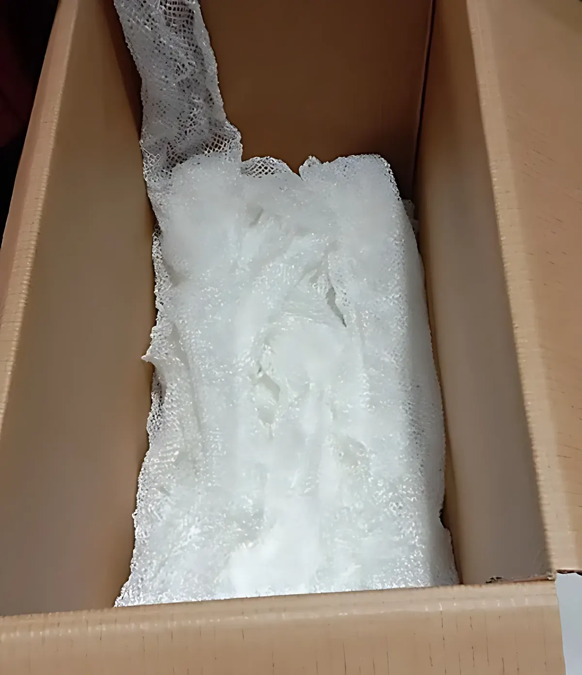 Continuous tube of boom netting packed in a carton