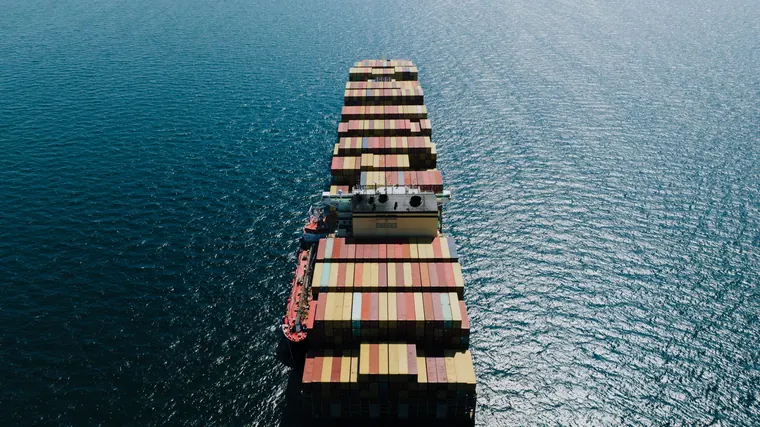 Container ship carrying export cargo
